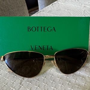 Bottega Veneta Sunglasses with Gold Frame and Dark Lenses